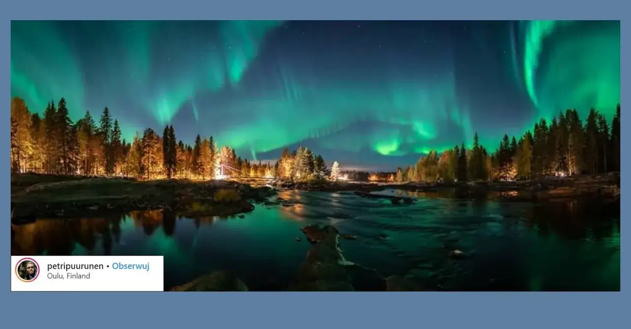 Aurora borealis nad rzeką w Finlandii, kraju słynącym z pięknych krajobraz&oacute;w i zorzy polarnej.